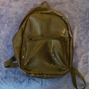 I just do not like this anymore A black patterned backpack